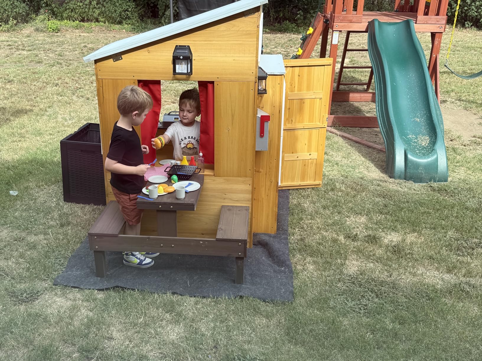 KidKraft Modern Outdoor Wooden Playhouse with Picnic Table, Mailbox and Outdoor Grill, Gift for Ages 3+ customer photo 1
