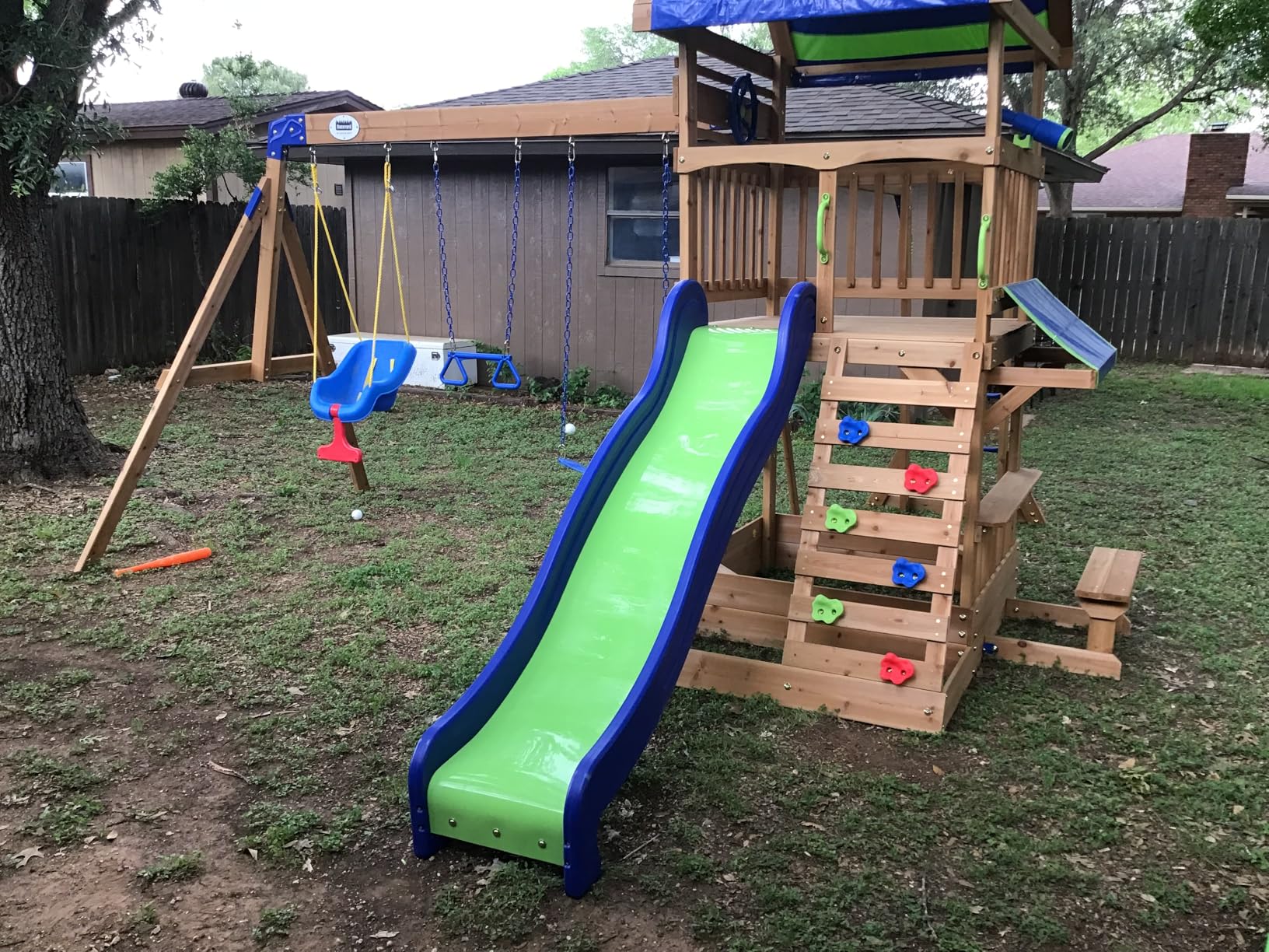 Backyard Discovery Beach Front Cedar Wood Swing Set with Wave Slide, Play Deck, Monkey Bars, Rock Wall Ladder, Shaded Picnic Area, Snack Bar, Belt Swings, Trapeze, Sandbox Area, Outdoor Playset customer photo 2