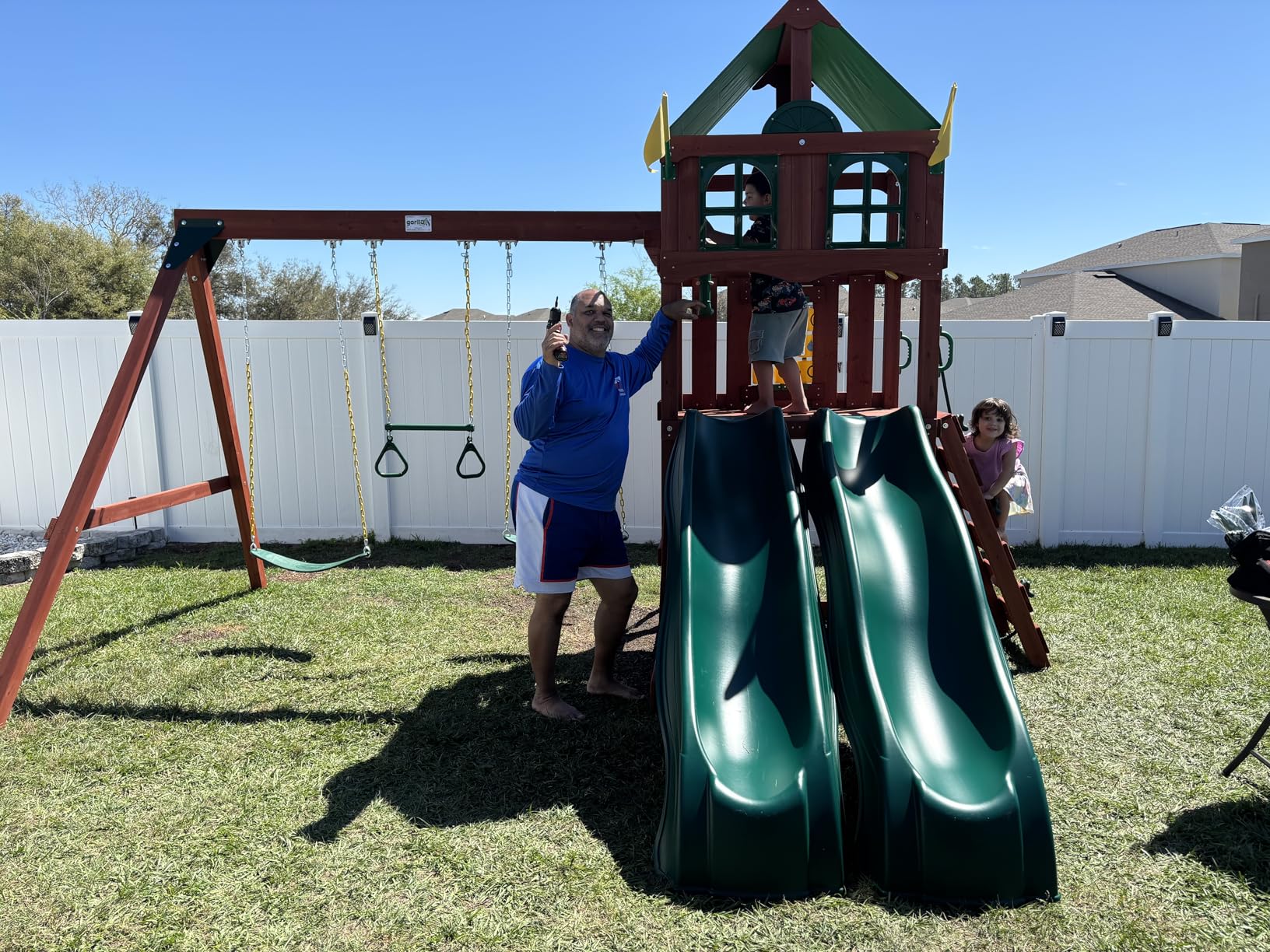 Gorilla Playsets Playmaker Deluxe Wooden Swing Set with Vinyl Canopy Roof, Dual Wave Slides, and Rock Climbing Wall, Redwood Stained Cedar customer photo 1