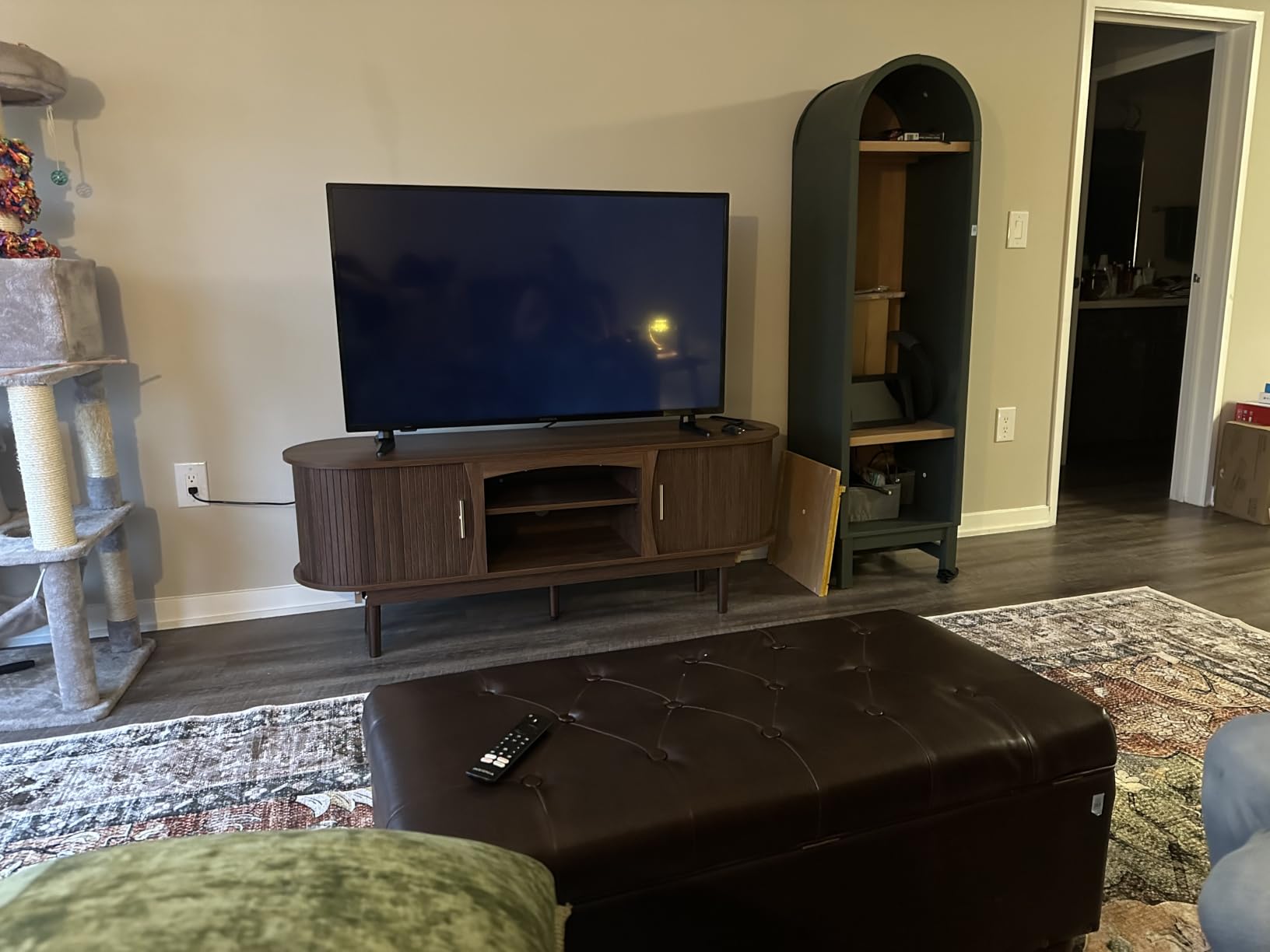 Decofy Mid Century TV Stand for TVs up to 65 Inches, Entertainment Center with Storage, Power Outlet, Fluted Sliding Doors & Adjustable Shelves, Modern Media TV Console Table for Living Room (Walnut) customer photo 1