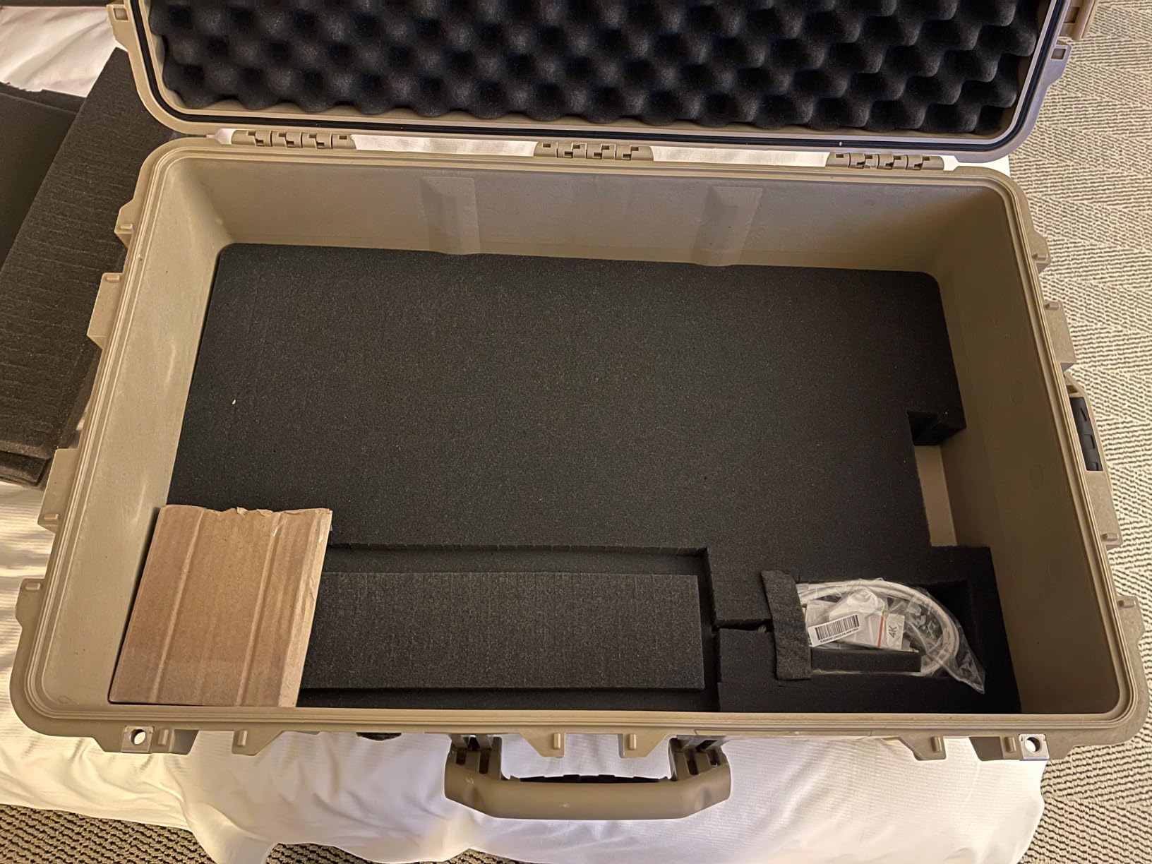 Pelican 1650 Case With Foam (Black) | Watertight wheeled case with foam insert and purge valve for protection, travel and transit customer photo 1