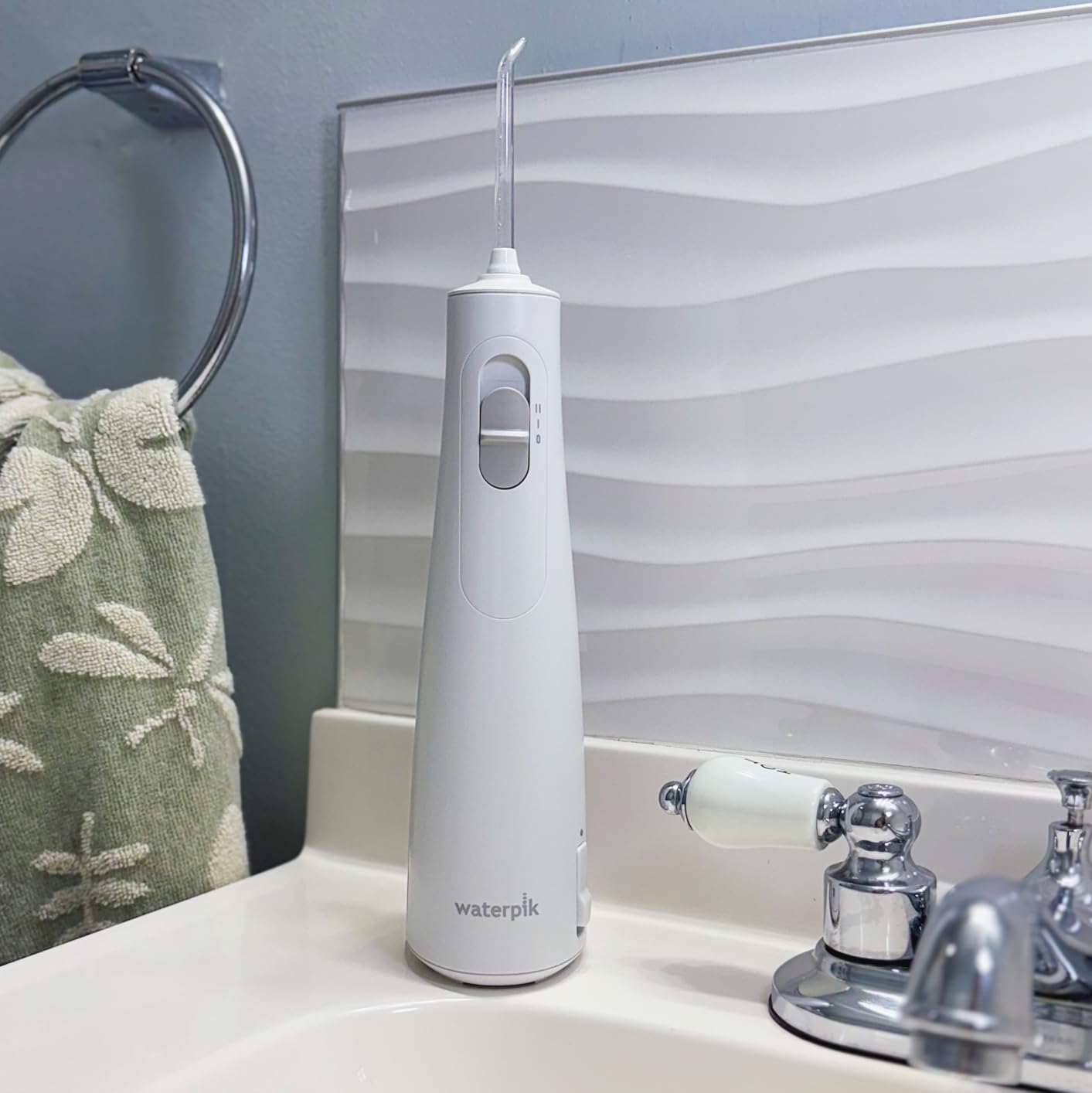 Waterpik Cordless 1100 Rechargeable Portable Water Flosser for Teeth Cleaning and Flossing, Travel, Braces Care, Healthier Gums, Waterproof for Shower, ADA Accepted, WF-30CD Black, Packaging May Vary customer photo 1