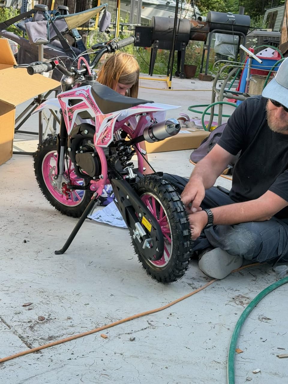 50CC Kid Dirt Bike, Gas Powered Mini Motorcycle for Kids 8-14 | Up to 35 MPH 330LBS Capacity with Front & Rear Disc Brakes, 10-Inch Off-Road Tires, Pull Start for Youth & Adults Red customer photo 1