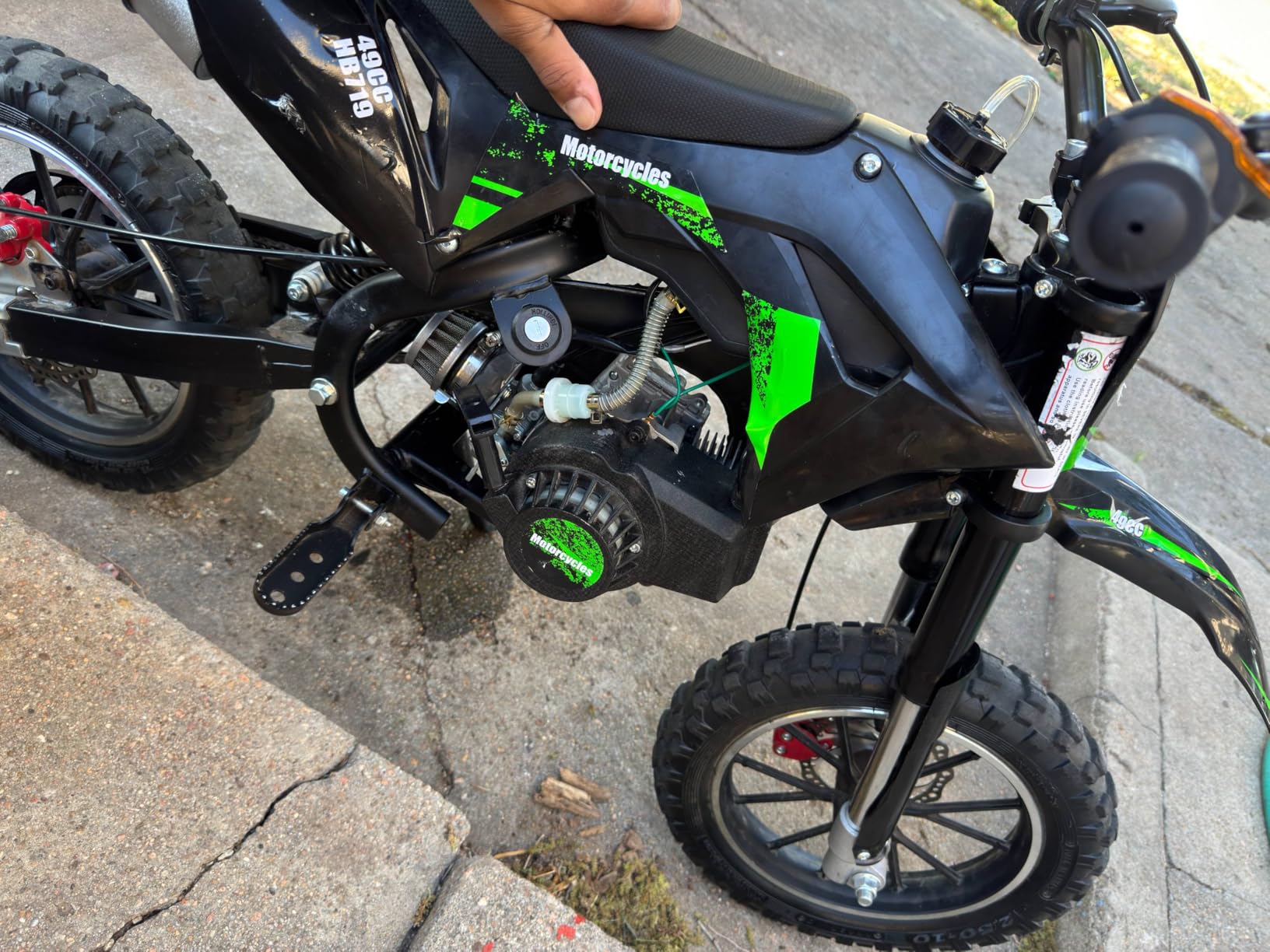 50CC Kid Dirt Bike, Gas Powered Mini Motorcycle for Kids 8-14 | Up to 35 MPH 330LBS Capacity with Front & Rear Disc Brakes, 10-Inch Off-Road Tires, Pull Start for Youth & Adults Red customer photo 2