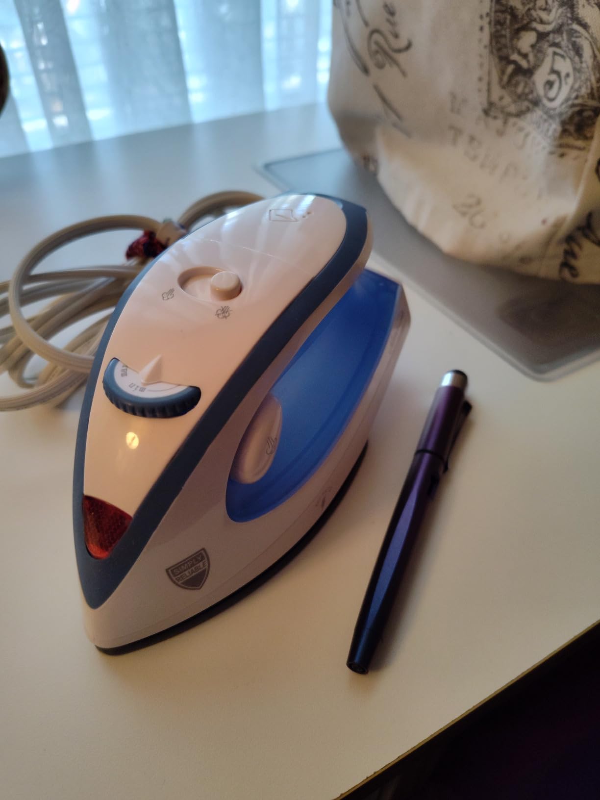 Sunbeam Hot-2-Trot Travel Steam Iron, 800 Watt Dual Voltage 120/240, Compact Size, Portable, Non-Stick Soleplate, Soft Touch Handle, Horizontal or Vertical Use, White and Blue customer photo 2