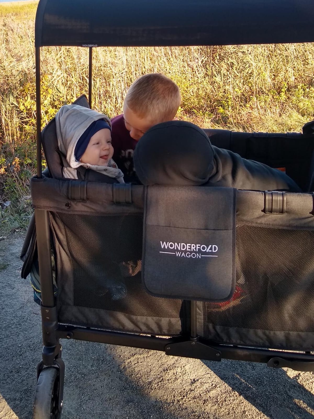 WonderFold W4 Original Stroller Wagon, 4 Seater, Black | Foldable Wagon with an Adjustable Canopy & Deep Carriage, All-Terrain Wheels & 5-Point Harnesses for Babies, Toddlers & Kids customer photo 1